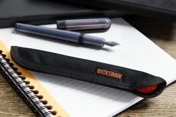 Rickshaw Bagworks 1 Pen Sleeve - Black/Orange 11 Rickshaw Bagworks 1 Pen Sleeve - Black/Orange -Office Tools Rickshaw 1PenSleeve BlkOrange 1